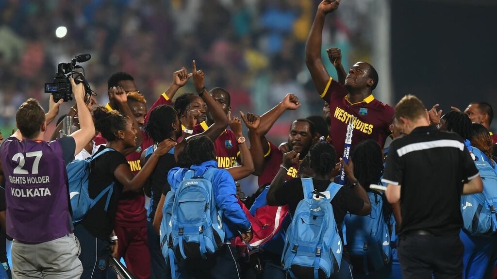 Carlos Brathwaite is besieged by media and teammates as he celebrates the West Indies’ victory over England in the World Twenty20 final in Kolkata. Photograph: DIbyangshu Sarkar/AFP/Getty Images