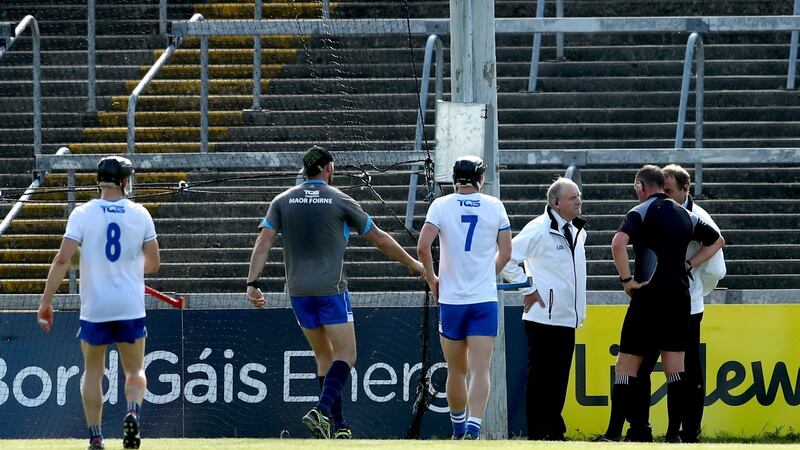 Referee Alan Kelly consults his umpires after the goal was awarded. Photo: James Crombie/Inpho