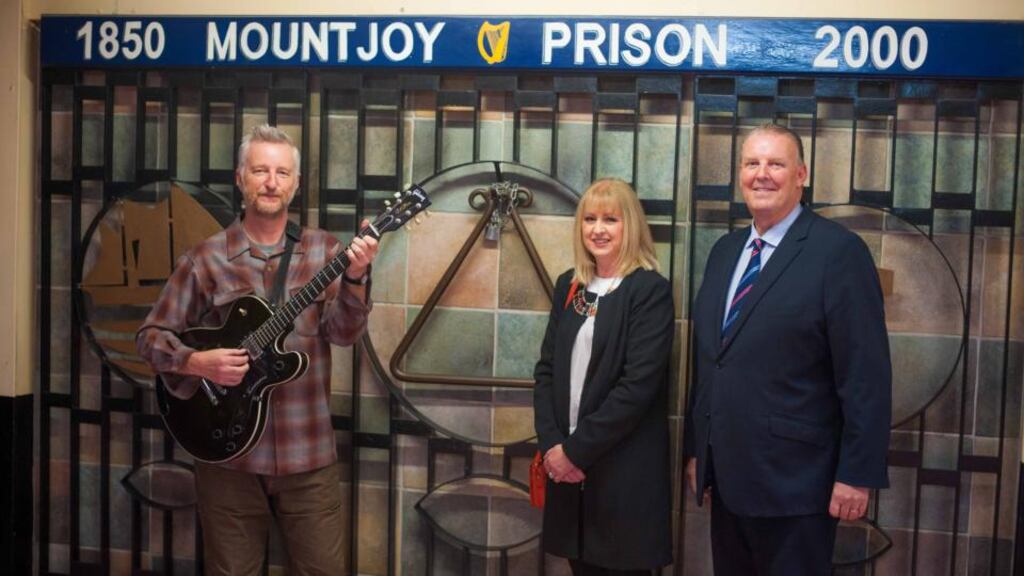 Billy Bragg; Deborah Blacoe, Philip Chevron’s sister; and Mountjoy campus governor Brian Murphy pictured as Chevron’s guitars were donated to Mountjoy Prison. Photograph: Aidan Oliver