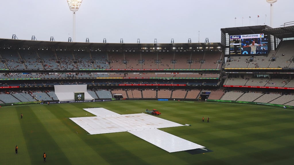 Covers can be seen over the pitch during a rain delay on the fourth day of the fourth Ashes cricket test match. Photo: David Gray/Reuters