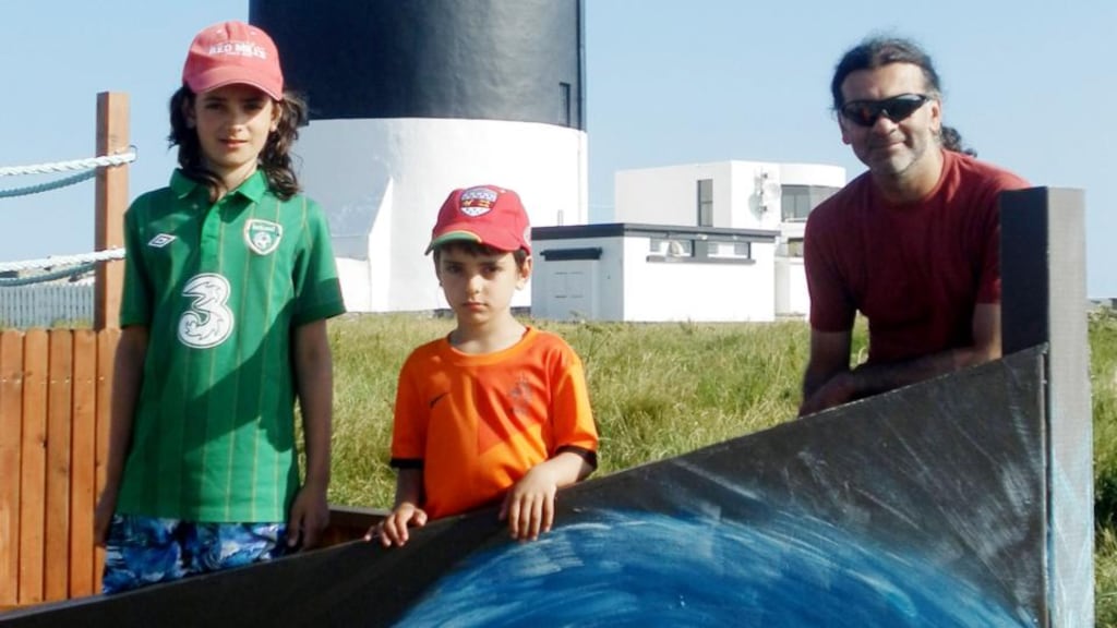 Sanjeev Chada, 43, (right) and his two children Eoghan, ten (left) and Ruairi, five, (centre). Photograph: Family handout photo/Garda
