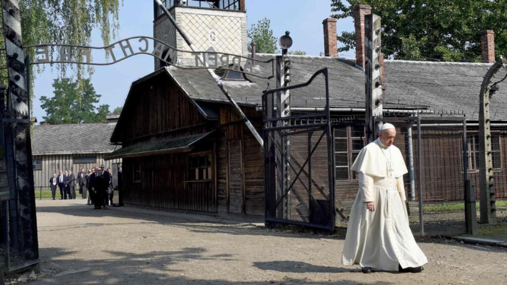 Pope Francis walks through the entrance of the former Nazi death camp of Auschwitz in Oswiecim, Poland on Friday. Photograph: Janek Skarzynski/AFP/Getty Images