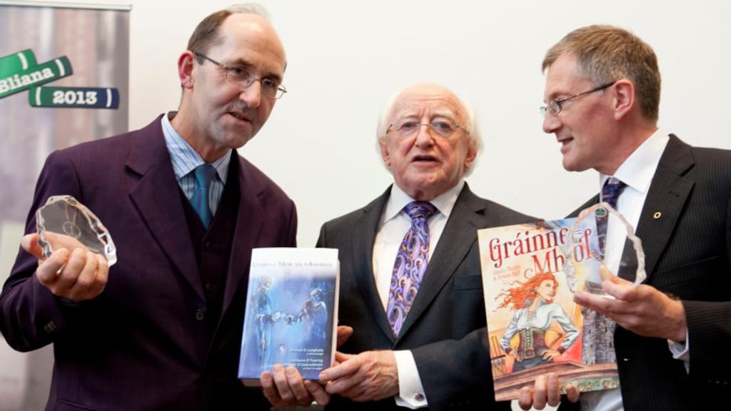 President Michael D Higgins with Micheál Ó Conghaile, one of the editors of Leabhar Mór na nAmhrán, and Colm Ó Raghallaigh, who published the graphic novel version of Gráinne Mhaol. Photograph: Johnny Bambury