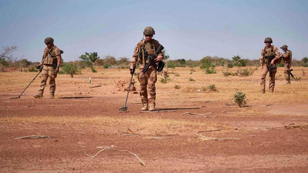 French soldiers use detectors to  search for improvised explosive devices during the Burkhane Operation in northern Burkina Faso, in November 2019. File photograph: Michele Cattani/AFP via Getty
