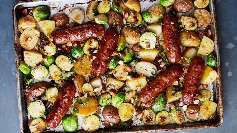 Sausages and Brussels sprouts with honey mustard. Photograph: Linda Xiao/The New York Times.
