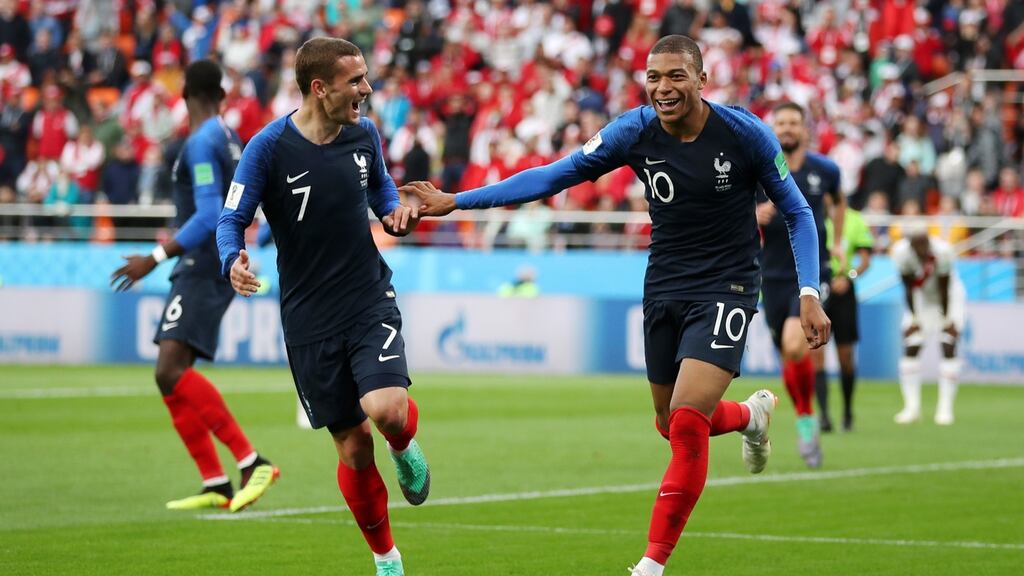 Kylian Mbappe celebrates his winner against Peru with Antoine Griezmann. Catherine Ivill/Getty