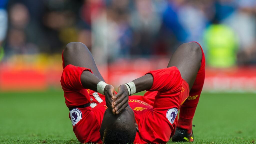 Liverpool’s Sadio Mane on the ground after picking up an injury during the Merseyside derby with Everton. Photo: Peter Powell/EPA