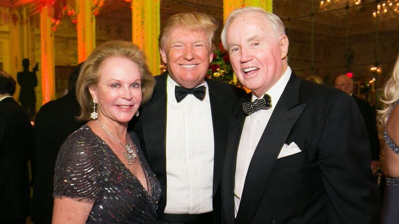 Brian Burns and his wife Eileen with Donald Trump at a ball in Florida. Photograph: Capehart