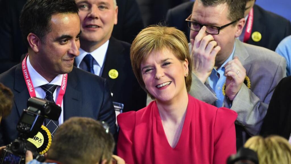 Nicola Sturgeon celebrates a stunning SNP performance in Glasgow, Scotland. The SNP has won at least 55 of the 59 seats in Scotland.