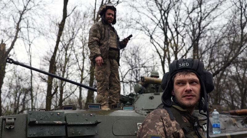 Ukrainian soldiers stand next to their armoured personnel carrier, not far from the front-line with Russian troops, in Izyum district, Kharkiv region on Monday. Photograph: AFP via Getty Images