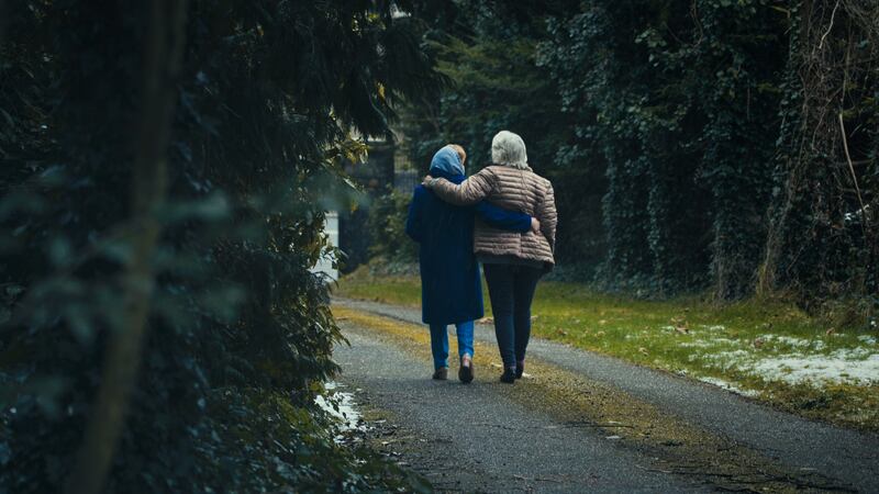 Dr Mary Randles walks with 'Betty'. Mary and her husband Paddy, also a doctor, helped Betty to keep her baby