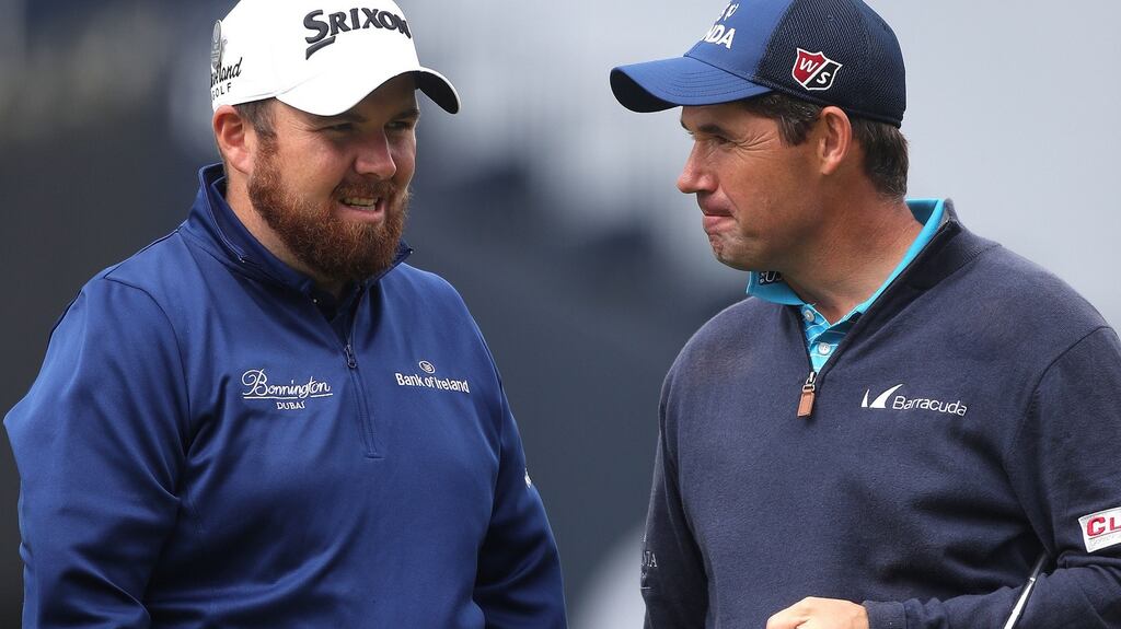 Ireland’s Shane Lowry and Padraig Harrington talk during practice at Royal Troon. Photo: Peter Byrne/PA Wire.