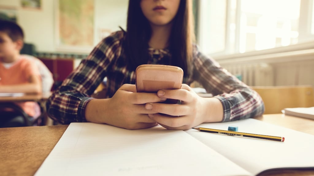 Many students are checking their devices in class on a regular basis, research shows. Photograph: Istock