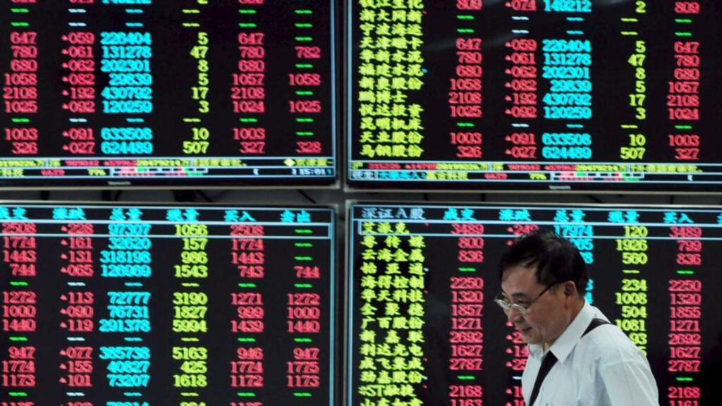 A brokerage house in Jiangxi province, China, The OECD has warned a combination of a sharp contraction in China and a shock in financial markets has the potential to derail the global recovery