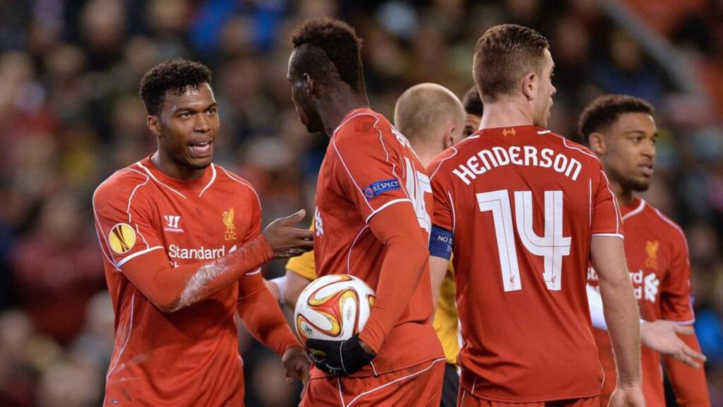 Liverpool’s Daniel Sturrdige talks to Mario Balotelli after he took the ball from Jordan Henderson before scoring the penalty for Liverpool’s 1-0 victory during the UEFA Europa League round of 32 match against Besiktas at Anfield. Photograph: EPA