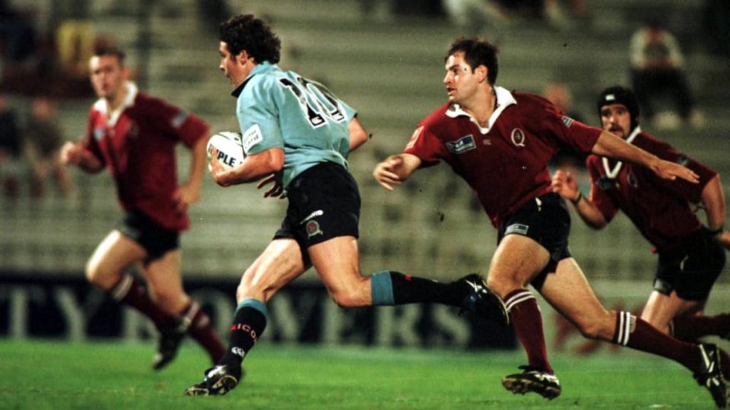Christian Warner of the NSW Waratahs evades the tackle of Ross West the Queensland Reds during the National Ricoh Championship game at Ballymore, Brisbane, Australia in 1999. We decided that the boys needed to do a few rounds of sparing as part of the pre-season. Photograph: Getty Images