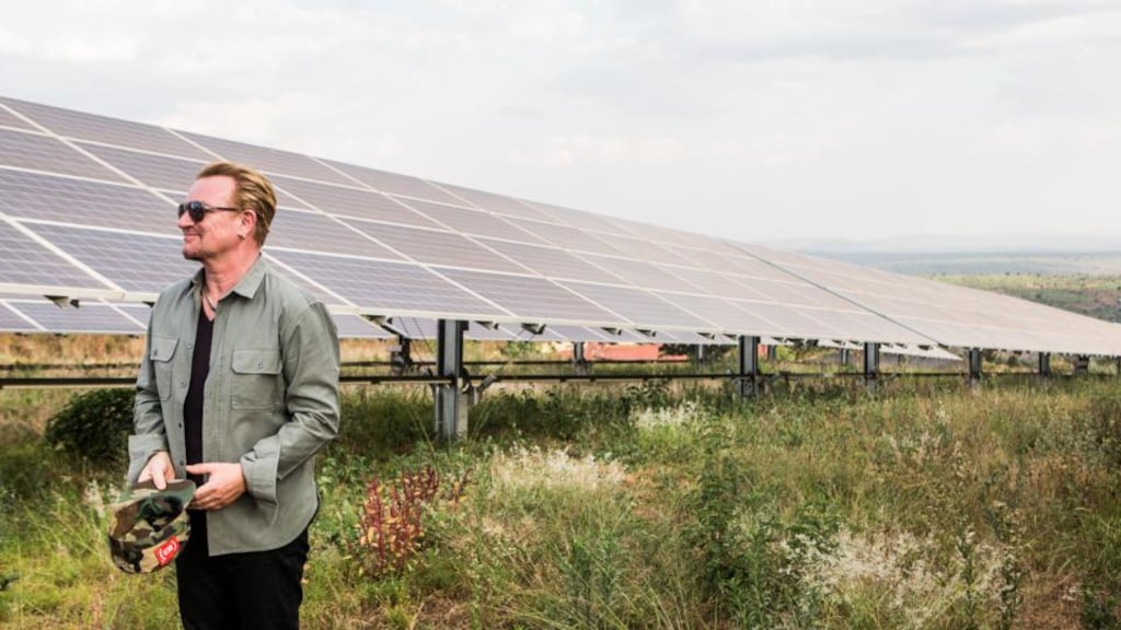 Bono at a solar array in Rwanda part-financed by President Obama’s Power Africa initiative