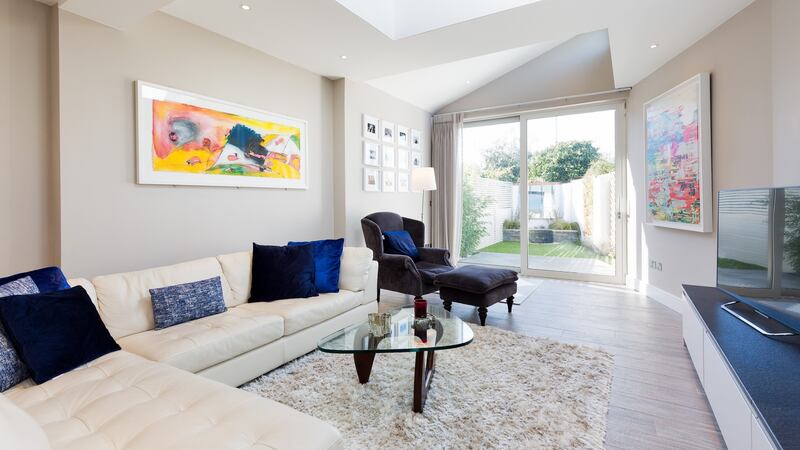 The extended living area is bright with a contemporary feel, with oversized glazed doors opening out to the rear garden