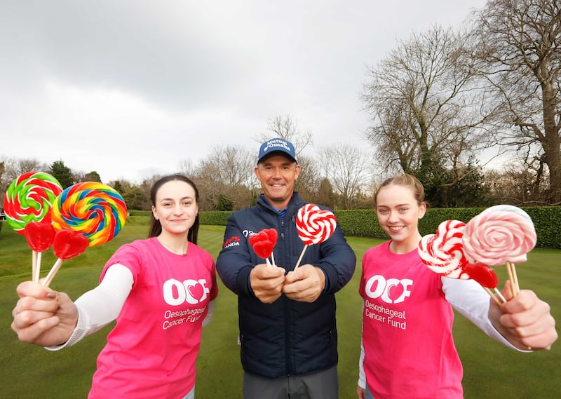 Volunteers Rose Martin and Emma O’Shaughnessy help charity patron, golfer Pádraig Harrington, to launch the Oesophageal Cancer Fund’s Lollipop Day, running on Friday, February 23rd and Saturday, February 24th, this year. Photograph: Leon Farrell/Photocall Ireland