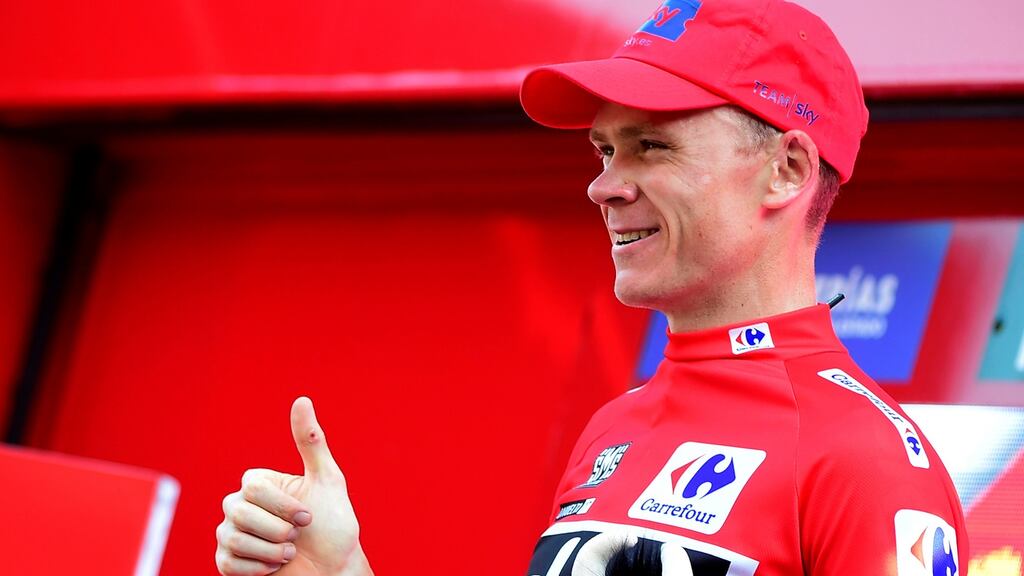 British cyclist Chris Froome celebrates retaining the red jersey on the podium of the 18th stage of the 72nd edition of Vuelta a España. Photograph: Jose Jordan/AFP/Getty Images