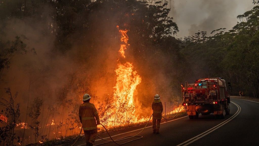 Fire crews burn off brush near Jerrawangala, Australia. Photograph: Matthew Abbott/The New York Times
