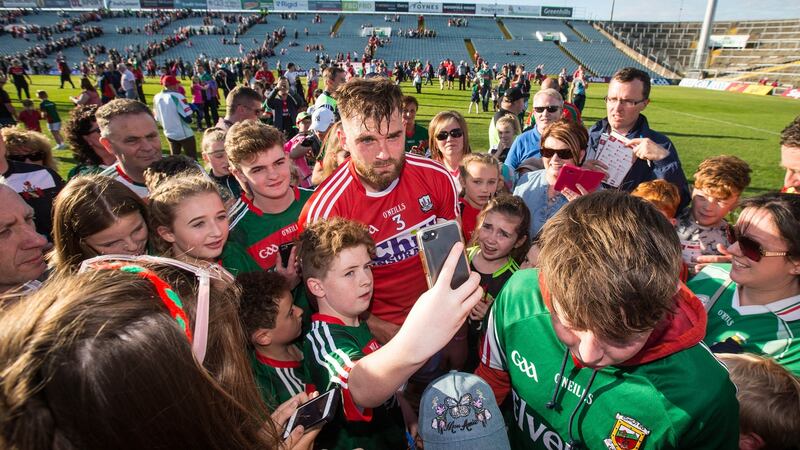 Aidan O’Shea with young fans after the qualifier win over Cork. Mayo’s loyal band of followers will descend on Croke Park for the clash with neighbours Roscommon. Photograph: Cathal Noonan/Inpho