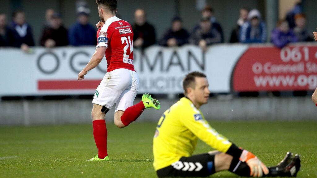 Cork City’s Sean Maguire celebrates scoring the first goal of the game as Limerick goalkeeper Brendan Clarke looks on dejected. Photo: Ryan Byrne/Inpho