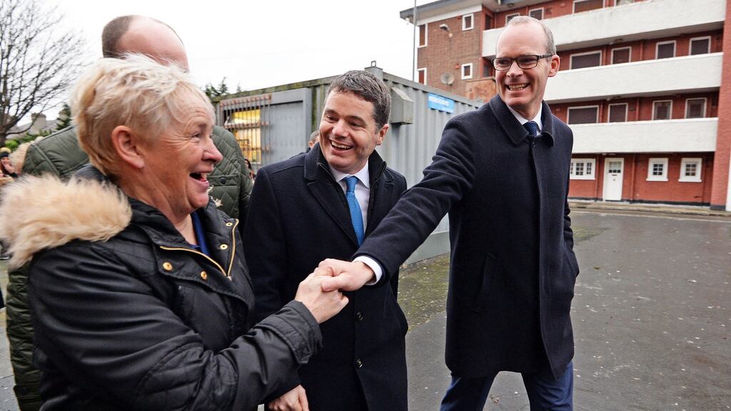 Resident Carol Wolfe greets Simon Coveney on announcing approval of the regeneration scheme for O’Devaney Gardens, Dublin on Wednesday. Photograph: Eric Luke/The Irish Times