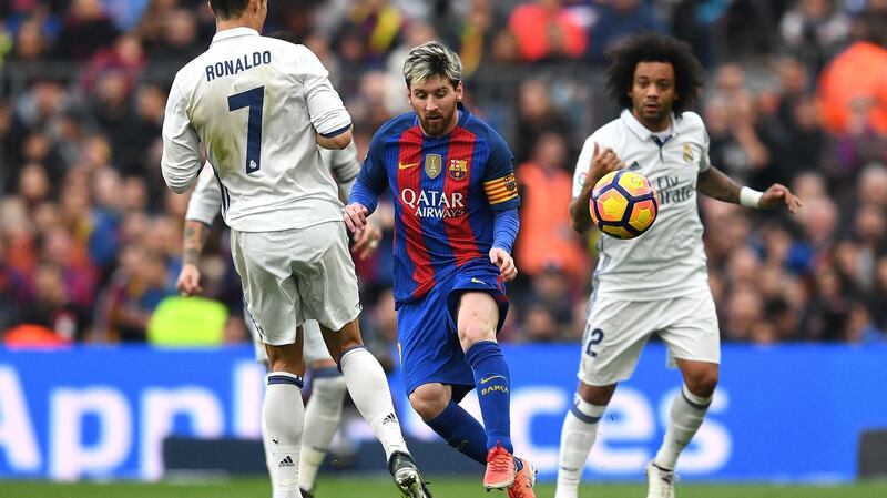 Messi goes past Ronaldo during the first Clasico of the season. Photo: David Ramos/Getty Images