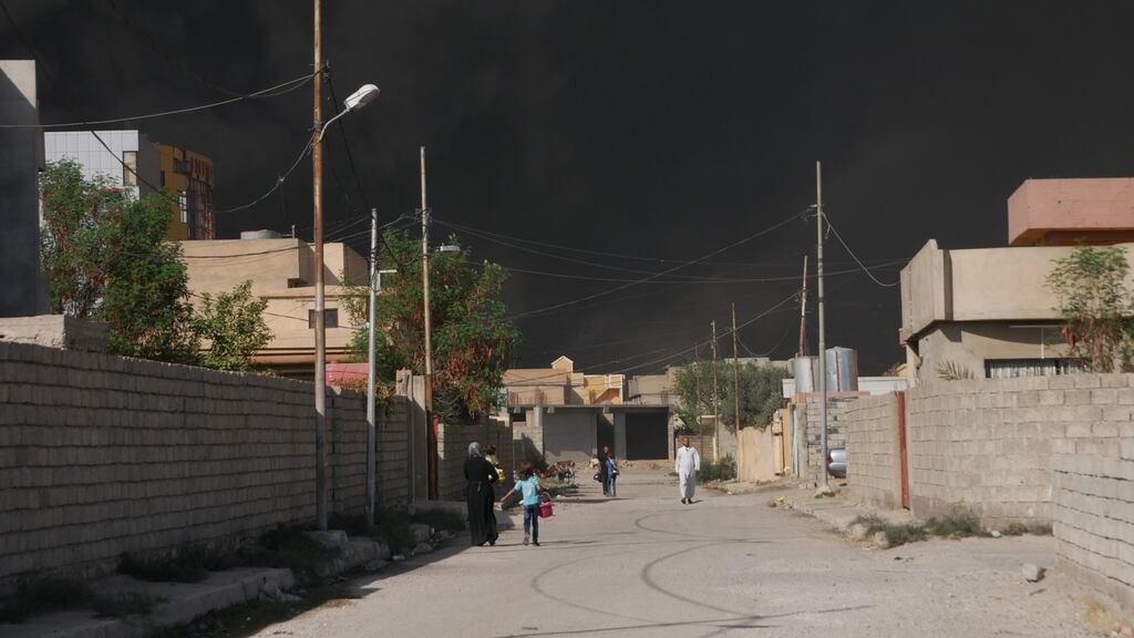 Qayyarah, a town of 15,000 people, has been engulfed in smoke from burning oil wells lit by retreating Isis fighters. Photograph: Ruaidhri Giblin