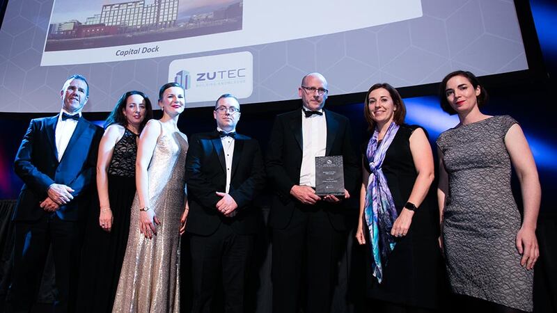 Clíona Farrelly, CEO, Zutec presents the Building of the Year - Office (Large) award to O’Mahony Pike Architects team.