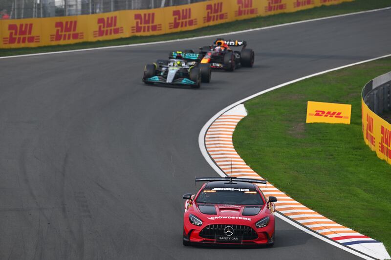 The safety car leads Lewis Hamilton and Max Verstappen during the Dutch Grand Prix. Photograph: Clive Mason/Getty Images
