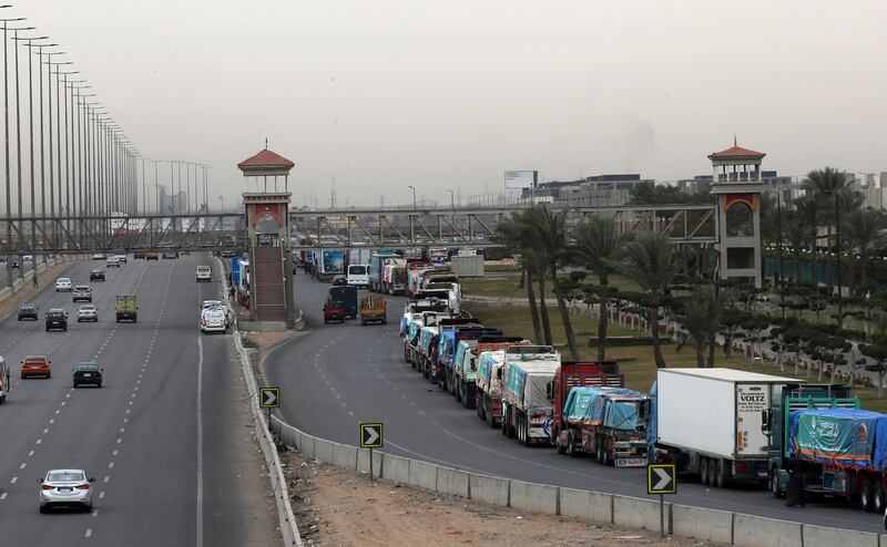 A convoy of trucks carrying humanitarian aid supplies for Gaza waits on the main Ismailia desert road, about 300km east of the Egyptian border with Gaza, on its way to the Rafah crossing on Tuesday. Photograph: Khaled Elfiqi/EPA
