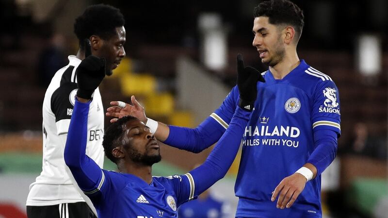 Kelechi Iheanacho of Leicester celebrates with teammate Ayoze Perez after scoring the opening goal during the Premier League win over Fulham at Craven Cottage. Photo: Peter Cziborra/EPA