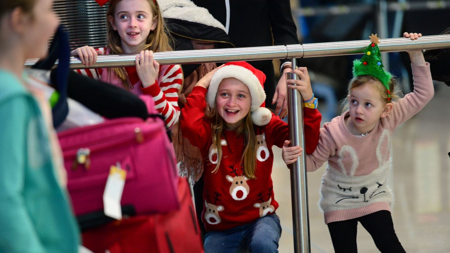Children waiting for relatives to arrive at Dublin Airport. Photograph: Dara Mac Dónaill