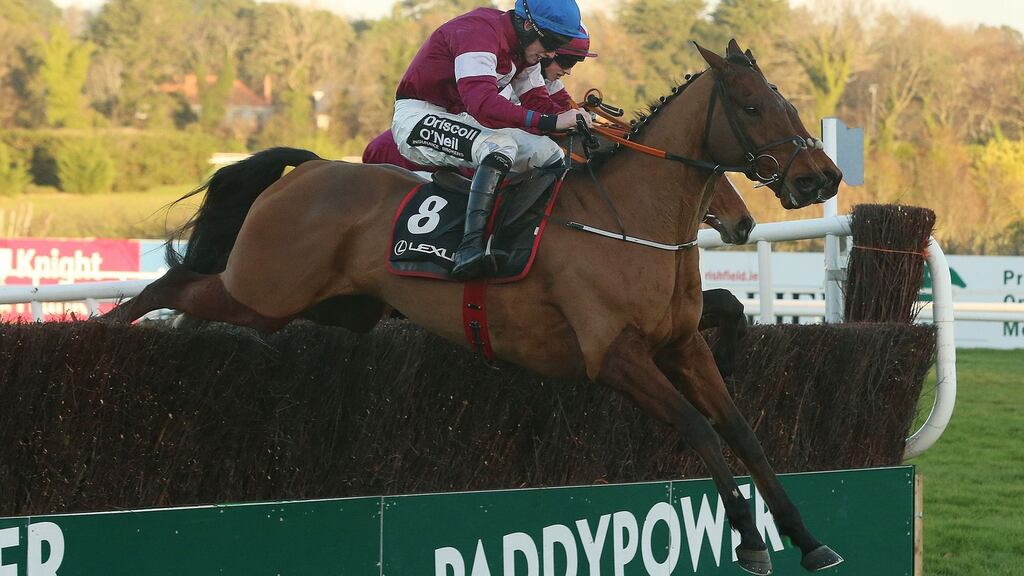 Outlander ridden by Jack Kennedy jumps the last to win The Lexus Steeplechase during day three of the Christmas Festival at Leopardstown Racecourse. Photograph: Niall Carson/PA