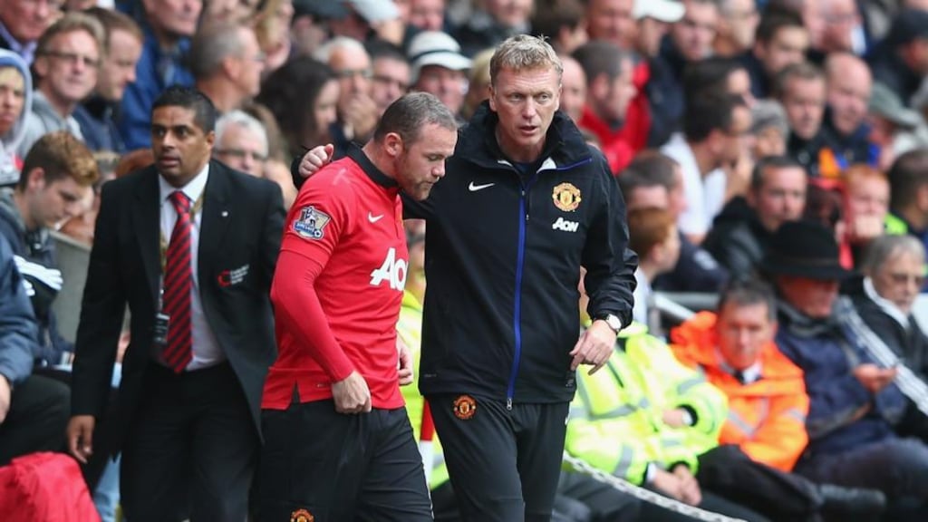 David Moyes (right) passes on final instructions as Wayne Rooney comes on as a substitute against Swansea. Photograph: by Michael Steele/Getty Images