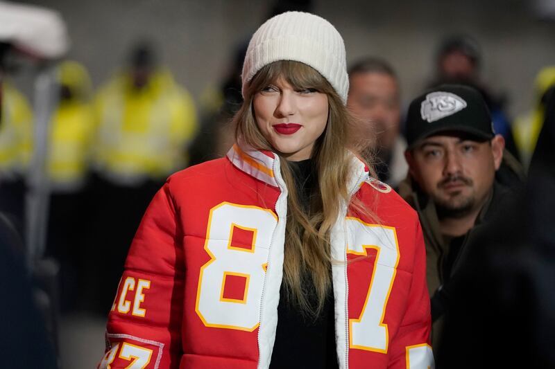 Taylor Swift clad in a Kansas City Chiefs jacket. Photograph: Ed Zurga/AP