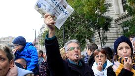 Hungarian PM’s grip on media tightens as leftist publisher sold