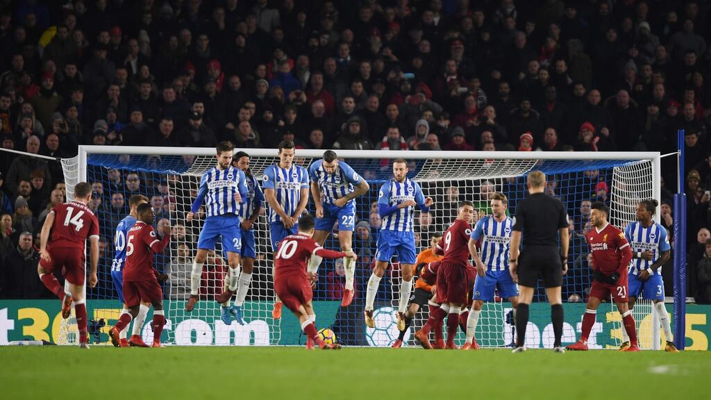 Philippe Coutinho of Liverpool scores his side’s fourth goal during their Premier League win over Brighton and Hove Albion. Photo: Mike Hewitt/Getty Images