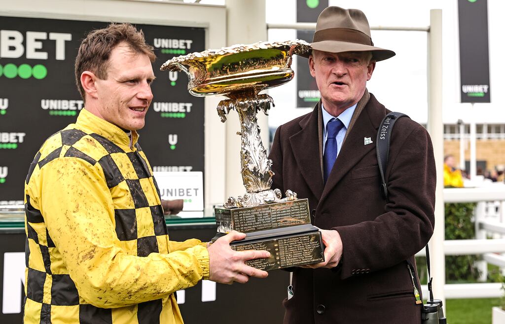 Jockey Paul Townend and trainer Willie Mullins lift the Champion Hurdle Challenge Trophy after winning with State Man. Photograph: Tom Maher/Inpho