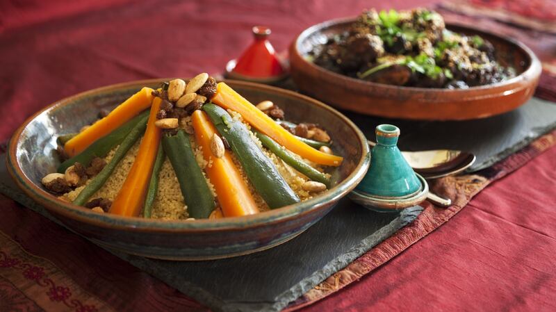 Traditional Moroccan dishes to try in Marrakesh: vegetable couscous and meat and prune tagine garnished with fresh coriander and sesame seeds. Photograph: Getty Images