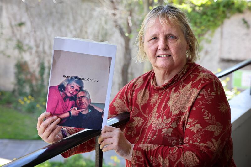 Mary Smith, with a photograph of her brother Christy. 'He was never given a chance at having his own life.' Photograph: Dara Mac Dónaill
