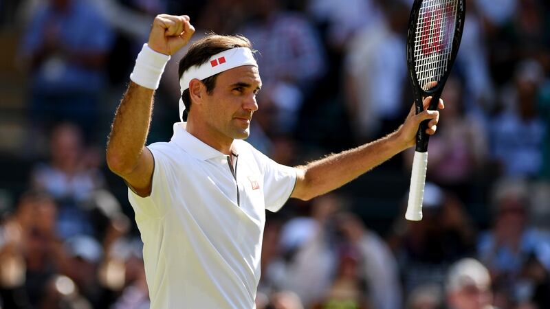 Roger Federer celebrates his straight sets victory over Jay Clarke. Photograph: Matthias Hangst/Getty