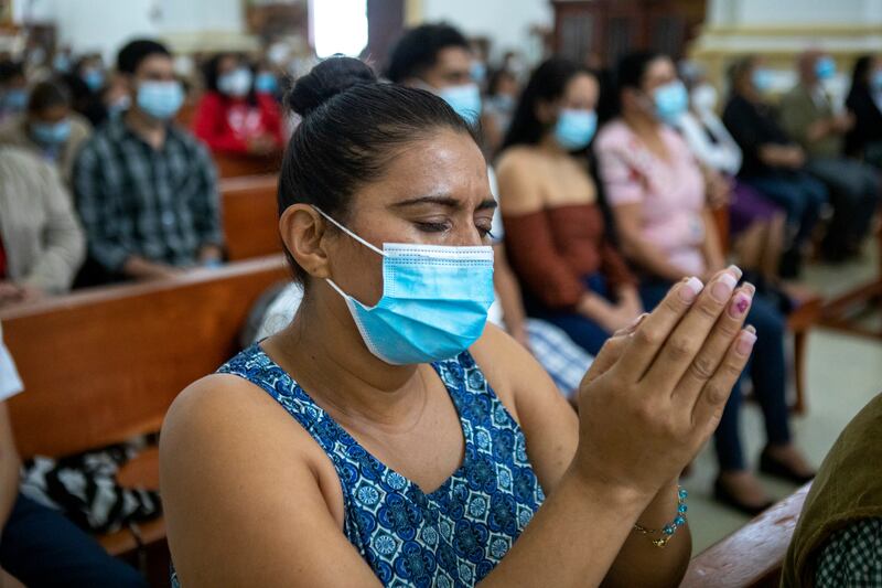 A woman prays at the Matagalpa Cathedral in Nicaragua, where Daniel Ortega’s authoritarian rule has tipped into systematic repression. Photograph: Inti Ocón/The New York Times