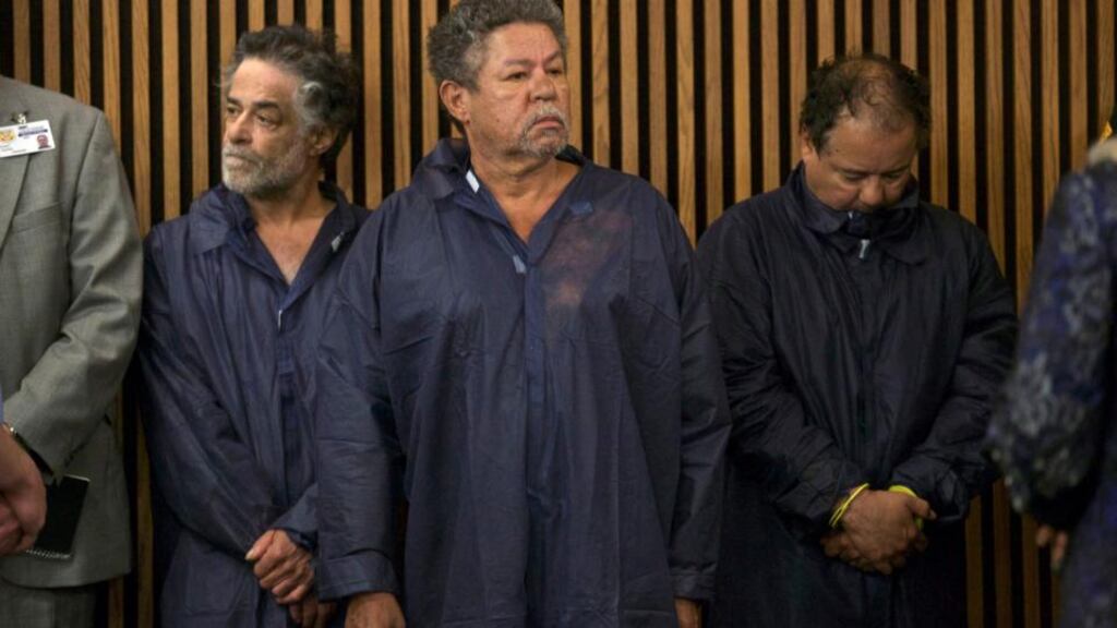 Ariel Castro (right), Pedro Castro (centre) and Onil Castro in court in Cleveland yesterday. Ariel Castro was formally charged with kidnapping and raping three women; his brothers were released without charge. Photograph: John Gress/Reuters