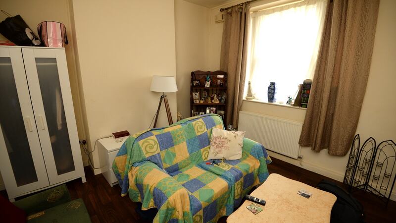 Mercer House flat: “I can’t put up any presses on the wall – they just fall down . . . It’s the pipes dripping behind the wall.” Photograph: Dara Mac Dónaill