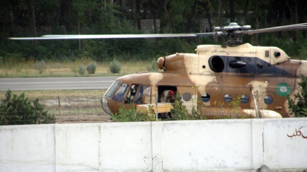 A coffin emerges from a Pakistani Army helicopter on its arrival at Gilgit Airport in Gilgit, Pakistan. The ambassadors of Norway and the Philippines to Pakistan were killed when a military helicopter crashed into a school in the north of the country an army spokesman said. The wives of the Indonesian and Malaysian ambassadors also died, along with the two pilots. Photograph: Zafae Abbas/EPA