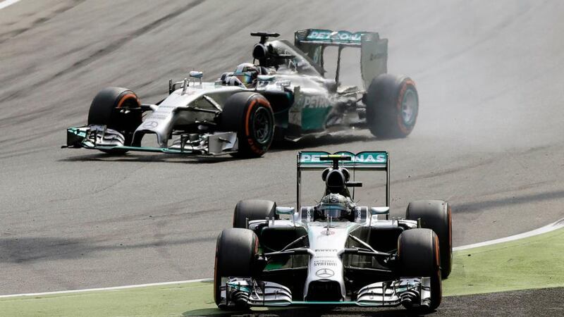 Mercedes driver Lewis Hamilton (top) of Britain passes his team-mate Nico Rosberg of Germany during the Italian Grand Prix at Monza. Photograph: Max Rossi /Reuters