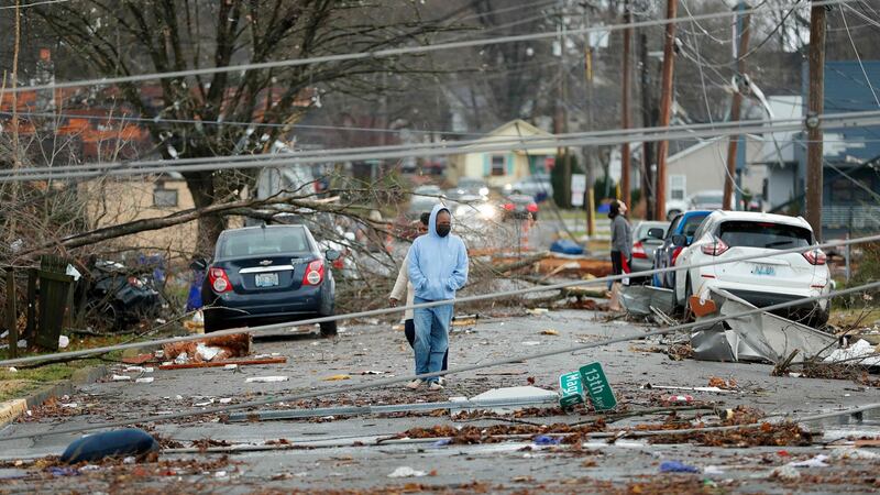 Bowling Green, Kentucky, residents look at the damage following a tornado that struck the area on Saturday. Photograph: Gunnar Word/AFP via Getty